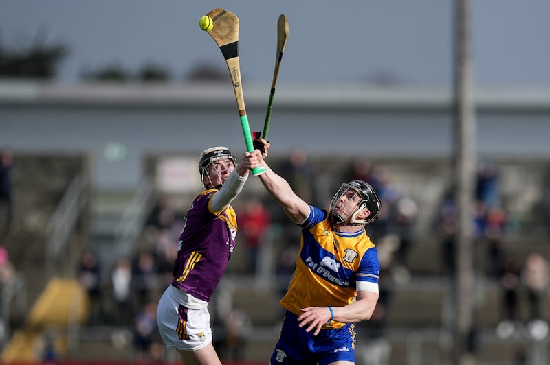 Clare's Tony Kelly in action against Wexford's Eoin Ryan at Cusack Park. Photograph: James Lawlor/Inpho