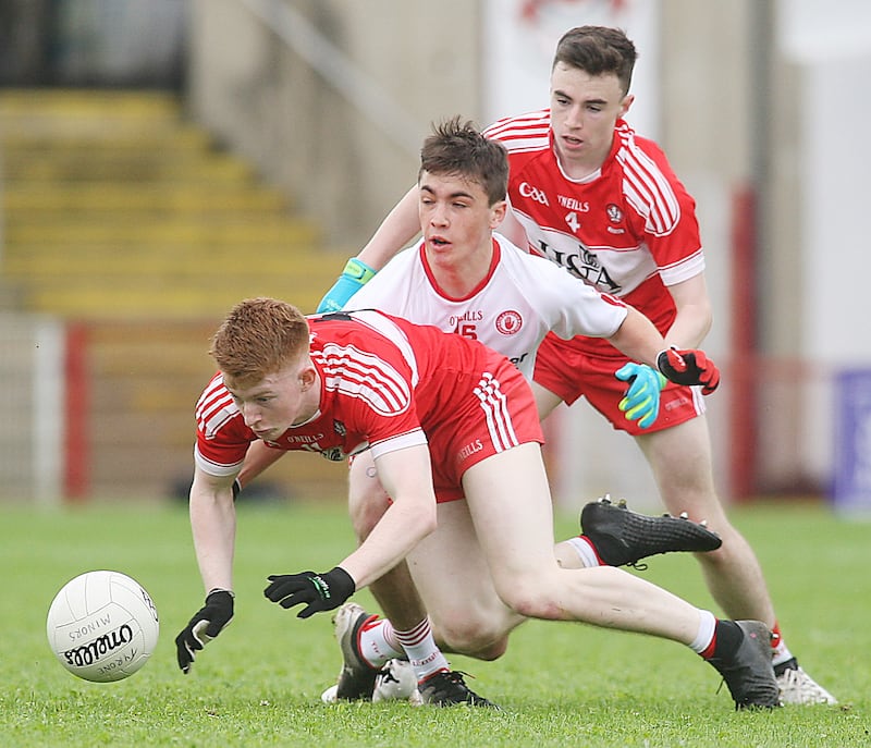 Derry's Declan Cassidy and Sean McKeever with Tyrone's Darragh Canavan during an Ulster MFC clash in 2017. Photograph: Lorcan Doherty/Presseye/Inpho





