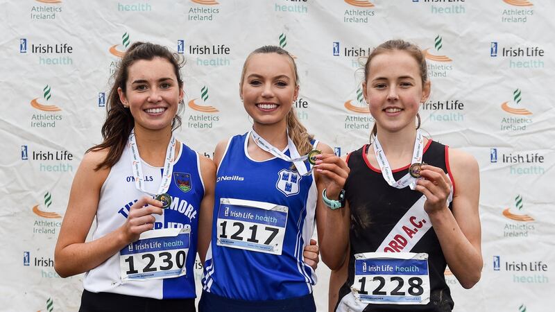 Junior women’s medallists Danielle Done (silver), Jodie McCann (gold) and Maeve Gallagher (bronze)  at the National Cross Country Championships in Dublin in November. Photograph: Sam Barnes/Sportsfile