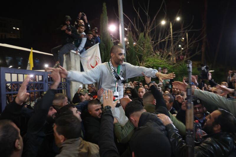 Zakaria Zubeidi, former Jenin chief of the Al-Aqsa Martyrs' Brigades, reacts as the crowd greets him in Ramallah, West Bank, after he was released from prison. Photograph: Alaa Badarneh/EPA