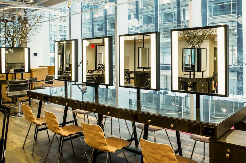 The 6,400sq ft hair salon operated by John Barrett in Manhattan. He filled it with books and art from his own collection, and light fare from Bouchon Bakery. Photograph: Dina Litovsky/New York Times
                      