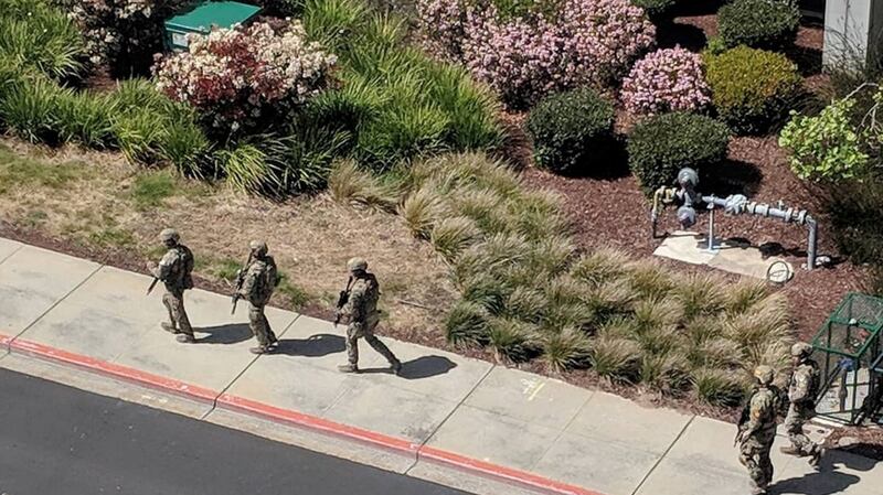 Law enforcement officials react following a  shooting at the headquarters of YouTube in San Bruno, California. Photograph: Graeme MacDonald/Reuters.