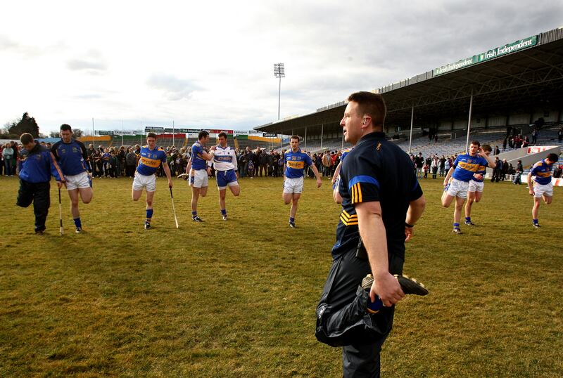 Cian O'Neill goes through the warm down with the Tipperary players after a league game in 2010 - when Liam Sheedy asked him to be the strength and conditioning coach for the Tipperary hurlers, that side of the house had no history of plugging into football people. Photograph: James Crombie/Inpho