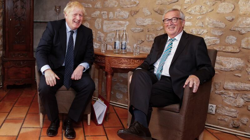 Acting European Commission president Jean-Claude Juncker (R) and British prime minister Boris Johnson (L) sit for a meeting in Luxembourg.  Photograph: Julien Warnand/EPA