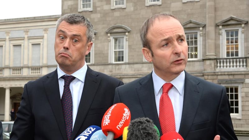 Picture 2: Former Labour TD Colm Keaveney on the plinth at the Dáil with Fianna Fail leader Micheál Martin  after his announcement that he was joining Mr Martin’s party. Photograph: Cyril Byrne/The Irish Times