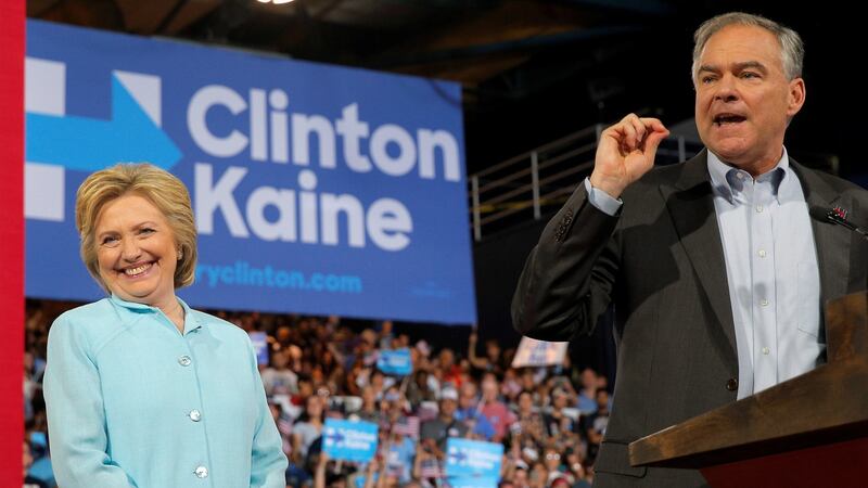 US Democratic presidential candidate Hillary Clinton reacts as running mate Senator Tim Kaine speaks at a campaign rally in Miami, Florida. Photograph: Brian Snyder/Reuters