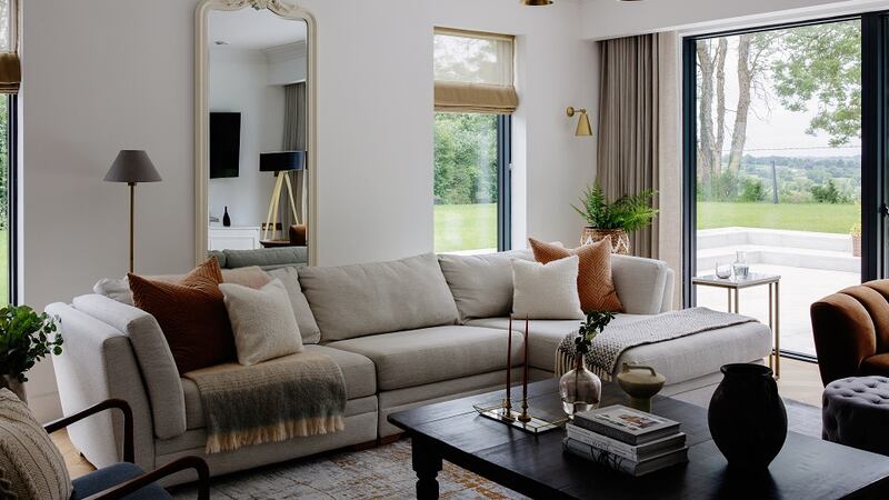 “White-on-white” and subtle tone neutrals were McGowan’s go-tos for this lovely area, which opens up off a larger central open plan kitchen diner