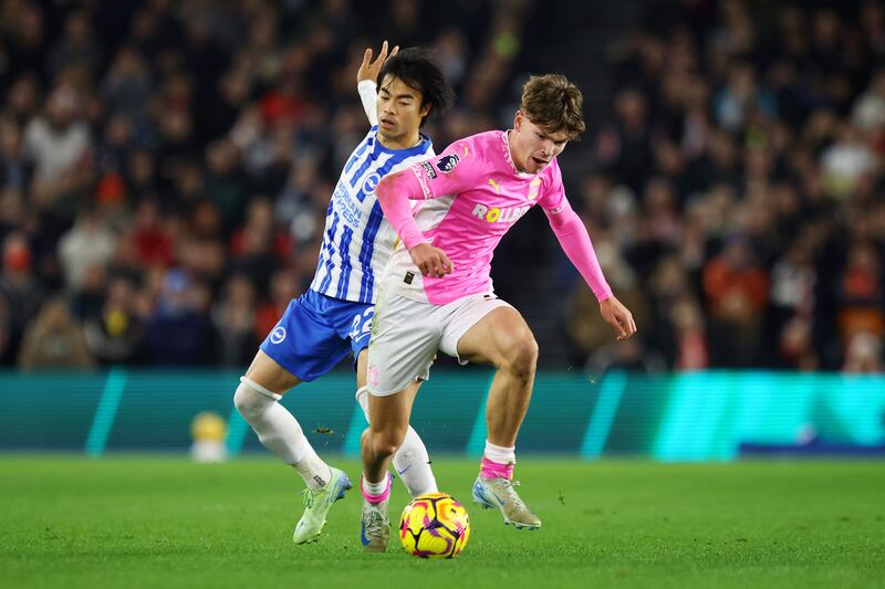 Southhampton's ball-carrying Tyler Dibling is challenged by Kaoru Mitoma of Brighton at the Amex Stadium in Brighton. Photograph: Charlie Crowhurst/Getty Images