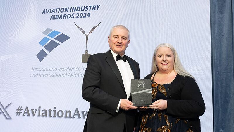 David Usher, awards judge, presents the aviation sustainability & environment award to Kirsty Murphy Hughes, daa group