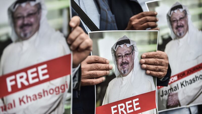 Protestors hold pictures of missing journalist Jamal Khashoggi during a demonstration in front of the Saudi Arabian consulate on Monday in Istanbul. Photograph: Zan Kose/AFP/Getty Images