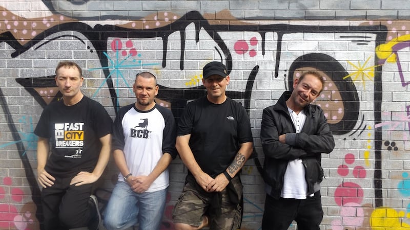 (From left) Boo, Stev McFaul, Aidy McLaughlin and Kevin McKenna in front of a mural by acclaimed graffiti and street artist Kev Largey