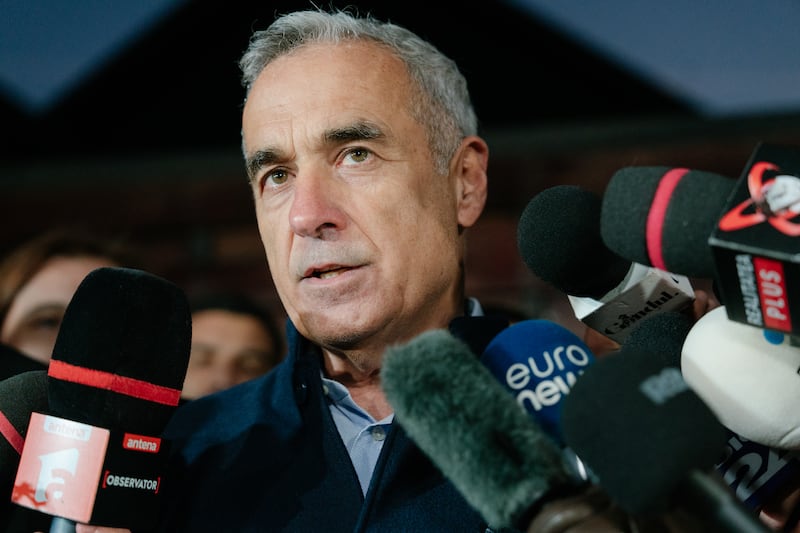 Romanian presidential candidate Calin Georgescu speaks to the media tjhis week in the village of Izvorani. Photograph: Andrei Pungovschi/Getty Images