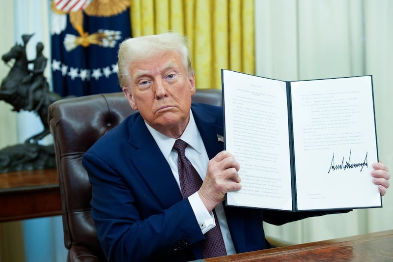 US president Donald Trump signs an executive order in the Oval Office on Thursday. Photograph: Yuri Gripas/Abaca/Bloomberg