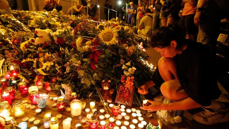 People bring flowers and candles to the Dutch embassy to commemorate the victims of the Malaysia Airlines Boeing 777 plane crash in Kiev, Ukraine, tonight. Photograph: Valentyn Ogirenko/Reuters