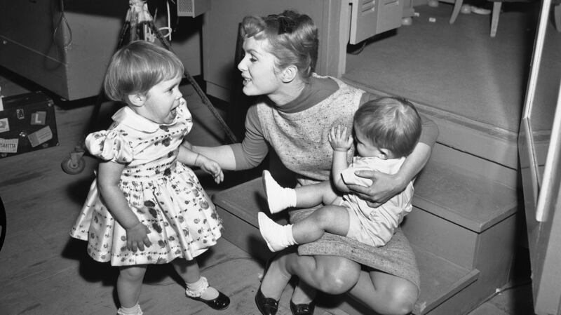 File photograph dated February  27th 1959 of Debbie Reynolds with her children Carrie and Todd Fisher. Photograph: AP