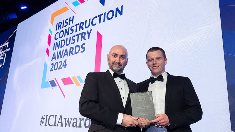 Barry Doyle, director at KSN Horizon, presents the contractor international project of the year award to Aidan McCarron, McAleer & Rushe