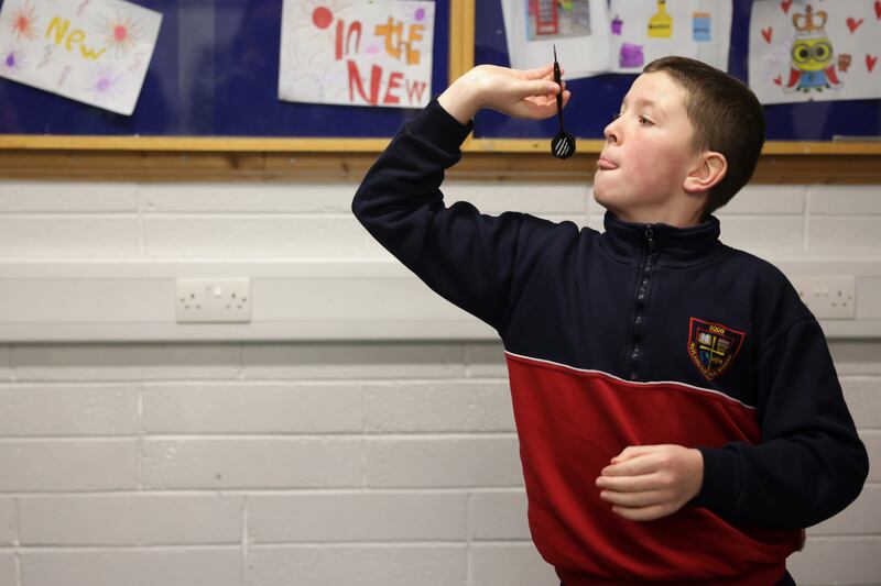 Junior Gurney plays darts at the Belvedere Youth Club in north Dublin. Photograph: Chris Maddaloni