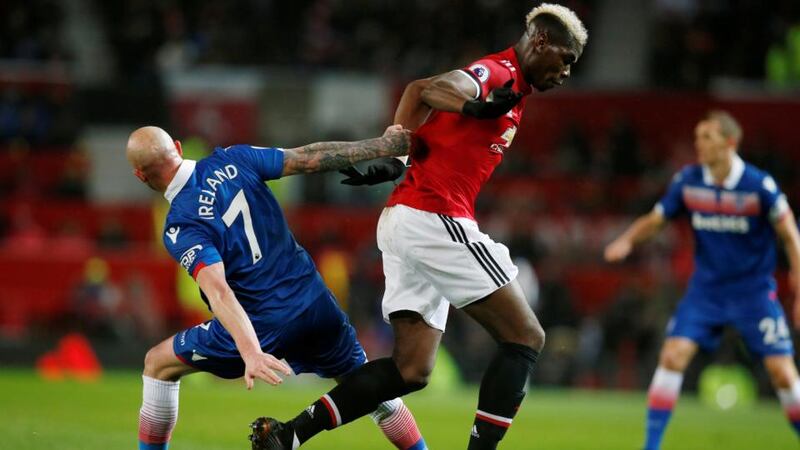 Stoke City’s Stephen Ireland challenges  Manchester United’s Paul Pogba during the Premier League game at Old Trafford. Photograph: Andrew Yates/Reuters