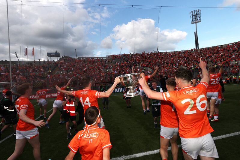 Armagh players celebrate with the Sam Maguire Cup. Photograph: Bryan Keane/Inpho