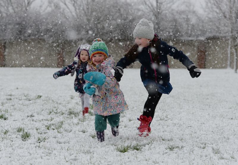 Clara Murphy, Bridget Harrington and Ella Murphy enjoy the snow at Dunboyne, Co Meath. Photograph: Alan Betson/The Irish Times