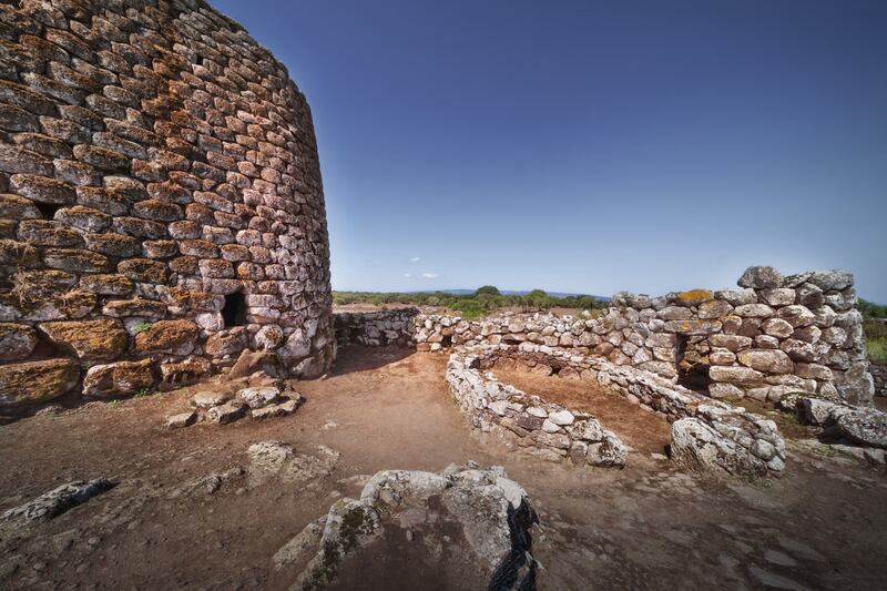 A historical castle near rock formations in Su Nuraxi, Sardinia. Photograph: Wirestock/iStock