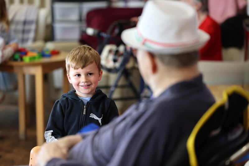 Troy shares a happy moment with a resident. Photograph: Dara Mac Dónaill