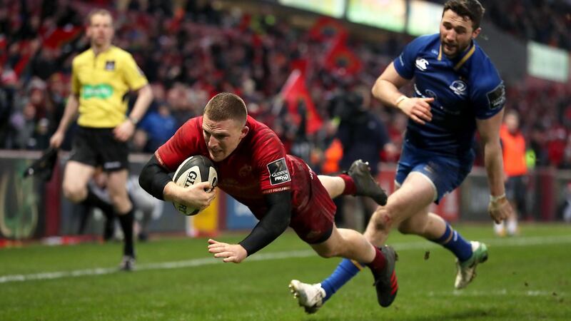 Munster’s Andrew Conway scores one of his two tries in the Guinness Pro 14 match against Leinster at Thomond Park. Photograph:  Billy Stickland/Inpho