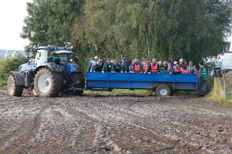 Stewards and judges are brought on to the field by tractor and trailer. Photograph: Alan Betson/The Irish Times