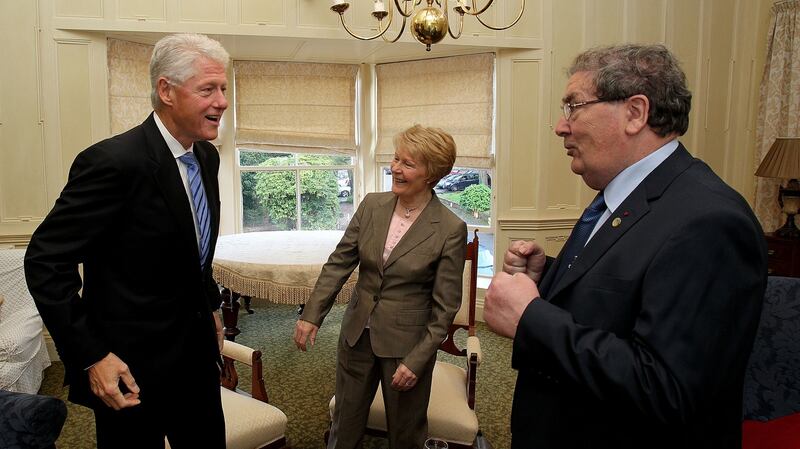 Former US president Bill Clinton with Pat Hume, and her husband John Hume in Derry, 2010. Photograph: Julien Behal/WPA Pool/Getty Images