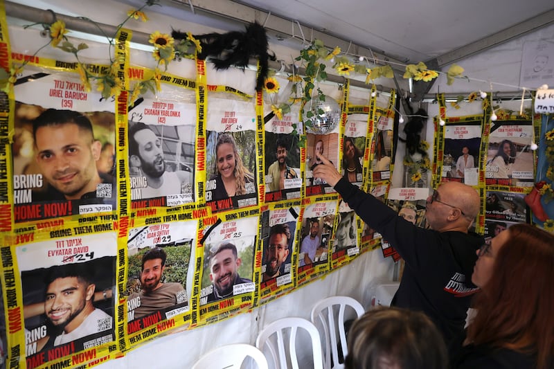 People look at a display of posters calling for the release of Israeli hostages, outside the Kirya military headquarters in Tel Aviv, Israel, on January 17th. Photograph: Abir Sultan/EPA-EFE