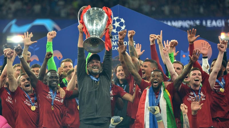 Liverpool  manager  Jürgen Klopp lifts the trophy after winning the Champions League final against  Tottenham Hotspur  at the Wanda Metropolitano stadium in Madrid. Photograph: Peter Powell/EPA