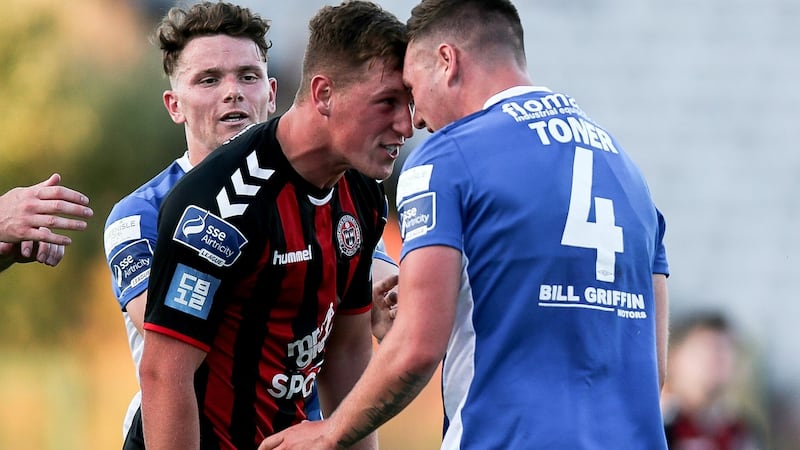 Bohemians’ Dan Casey clashes with Kevin Toner of St. Patrick’s. Photograph: Gary Carr/Inpho