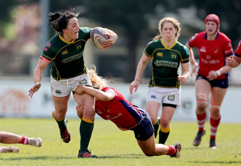 Lindsay Peat is tackled Aoife Corey of UL Bohs during the clash at St. Mary's College RFC. Photograph: Dan Sheridan/Inpho