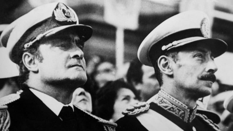 General Jorge Videla (right), leader of the 1976 military coup that began the seven-year “Dirty War,” stands next to junta member Admiral Emilio Massera during a ceremony in Buenos Aires, in this 1979 file photo. Jorge Rafael Videla, an austere former army commander who led Argentina during the bloodiest days of its Dirty War dictatorship and was unrepentant about kidnappings and murders ordered by the state, died in prison today, at age 87. Photograph: Reuters