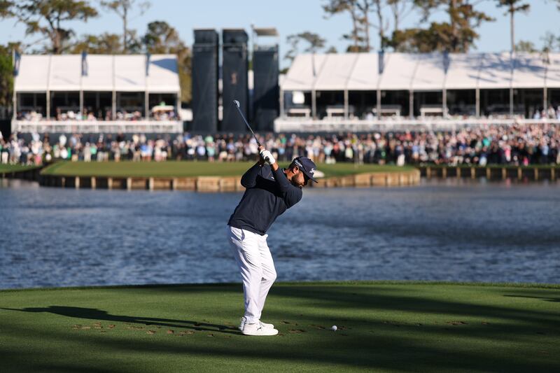 JJ Spaun plays his shot from the 17th tee during the play-off. Photograph: Richard Heathcote/Getty Images