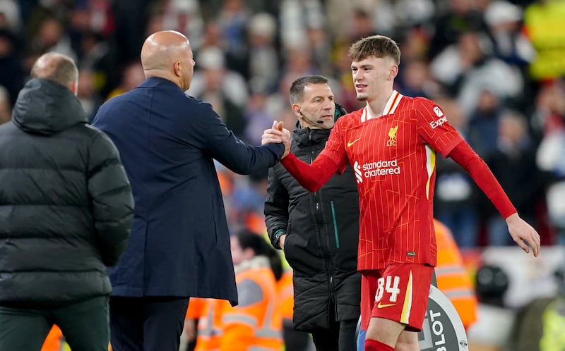 Liverpool's Conor Bradley (right) is congratulated by Liverpool manager Arne Slot after coming off as a substitute against Real Madrid. Photograph: Peter Byrne/PA