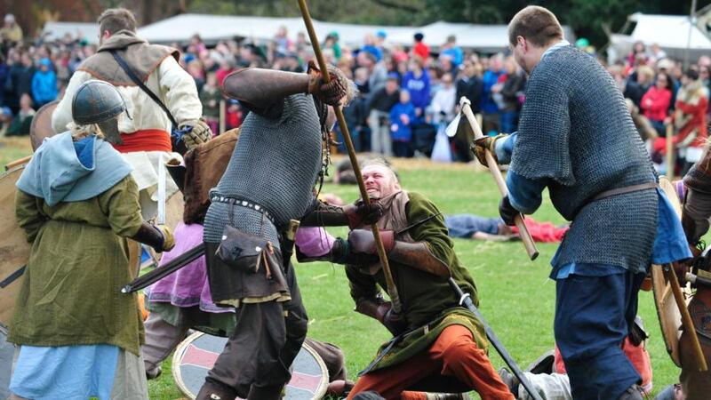 Take that, foe: Viking re-enactors stage the Battle of Clontarf at a festival in St Anne’s Park at the  weekend. Photograph: Aidan Crawley