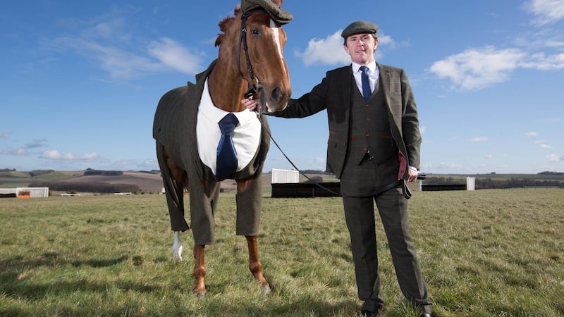 Morestead modelling a tweed suit designed by former Alexander McQueen apprentice Emma Sandham-King. Photograph:   David Parry/PA Wire