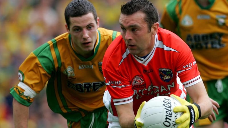 Saving grace: Oisín McConville playing for Armagh in the 2006 Ulster final at Croke Park, against Donegal. Photograph: Bryan O’Brien