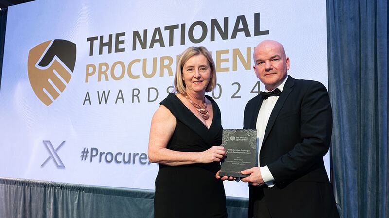 Bernie Fitton, senior field marketing manager at Ivalua, presents the best education, training or people development award to Michael Cunningham, Kerry Group