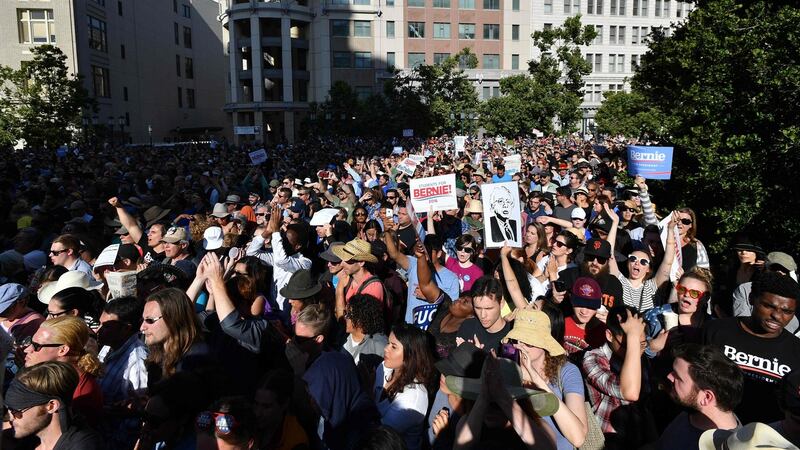 Supporters cheer  Democratic presidential candidate Bernie Sanders  at a rally in Oakland, California on Monday. Photograph: Josh Edelson/AFP/Getty Images