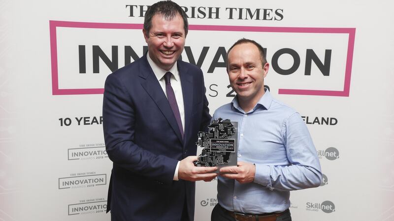 Cormac Deady, consulting partner with KPMG, presents the IT & Fintech innovation award to Farm Hedge co-founder and chief executive John Garvey