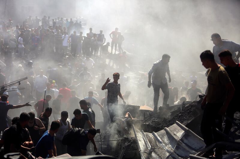 Palestinians inspect the rubble of destroyed buildings following Israeli air strikes on Khan Younis on Thursday. Photograph: Mohammed Dahman/AP