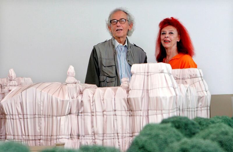 Christo and Jeanne-Claude:  the artists with a model of Wrapped Reichstag in 2009. Photograph: Raquel Manzanares/EPA