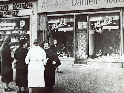 People outside a Jewish-owned shop in Germany after Nazi-incited mass riots of Kristallnacht in November 1938. Photograph: AP