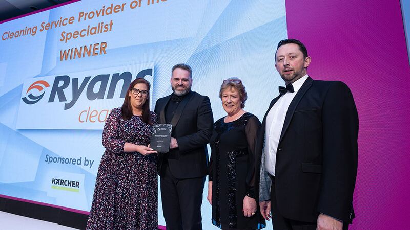 Mark Keeley, sales manager at Kärcher Ireland, presents the Cleaning Service Provider of the Year - Specialist award to Ryans Cleaning team.