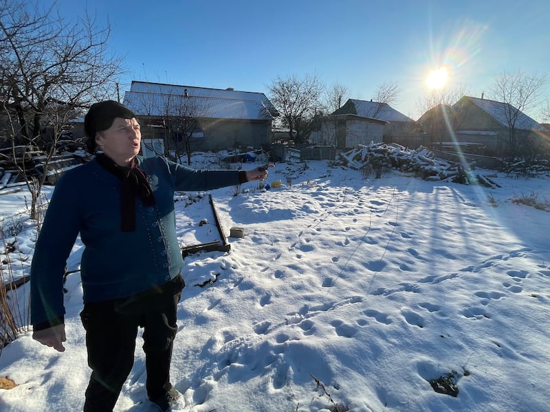 Russian troops positioned an artillery gun and troops behind Nelya Honchar's house in the village of Kozarovychi, north of Kyiv, in February-March 2022. Her home was destroyed by shelling and now she lives in a one-room temporary building on the site. Photograph: Daniel McLaughlin