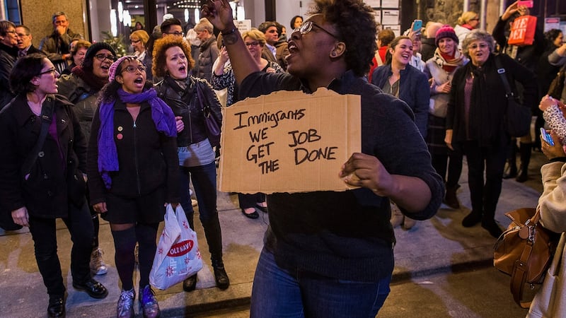 Protesters shout slogans at US vice president-elect Mike Pence as he leaves the Richard Rodgers Theatre in New York on Friday. Photograph: Andres Kudacki/AP