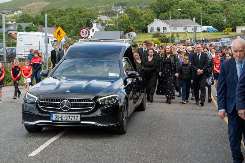 The cortege arrives for the funeral Mass at St Mary's Church in Dingle, Co Kerry. Photograph: Noel Sweeney/PA Wire 