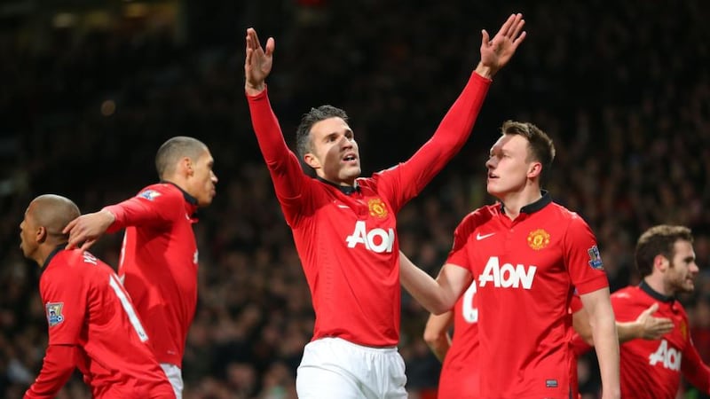 Manchester United’s Robin van Persie (centre) celebrates after scoring his team’s first   at Old Trafford.  Photograph:  Dave Thompson/PA Wire